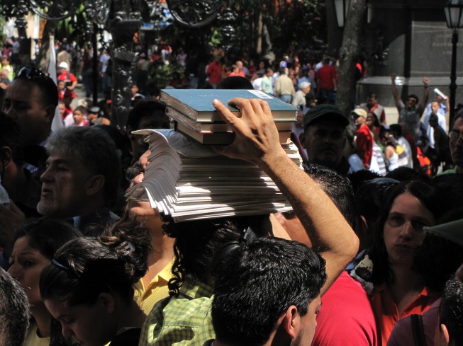 A street vendor sells copies of the constitution.
